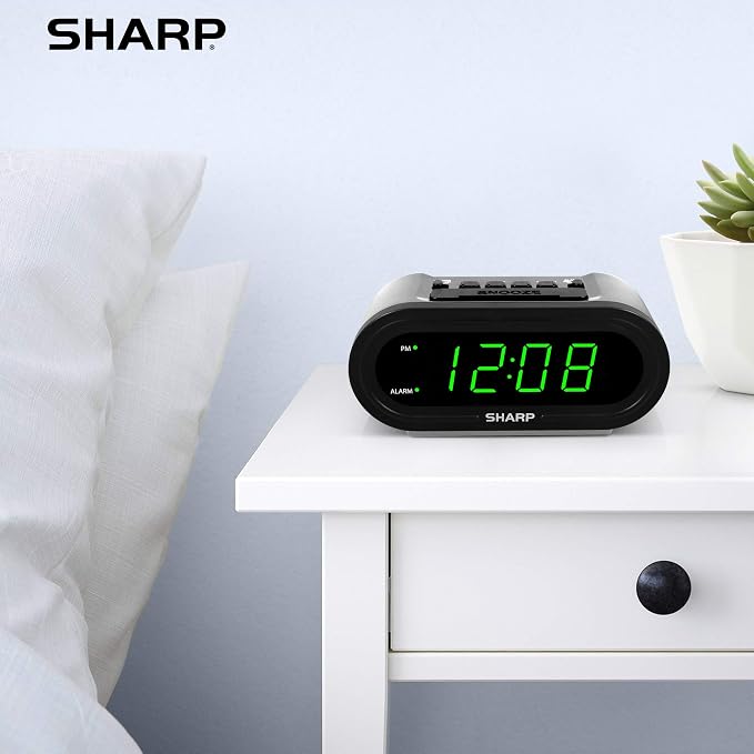 Sharp AccuSet Self-Setting Alarm Clock with Auto DST, Green LED | Automatic time setting; Auto DST adjustment; Battery backup; Easy-read LED display; Simple plug-and-play setup