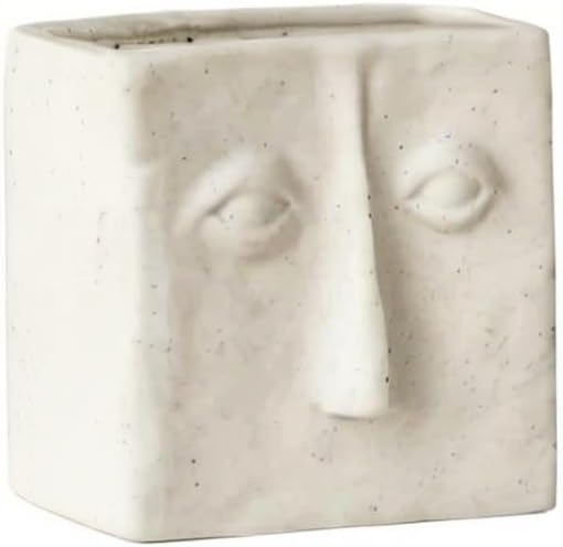 WENSHUO Ceramic Pen Holder, Pencil Holder for Desk, Desk Accessories, Crème | 3.7 in tall ceramic holder for pens, pencils, makeup brushes, or toothbrushes. Abstract face design displays small plants.