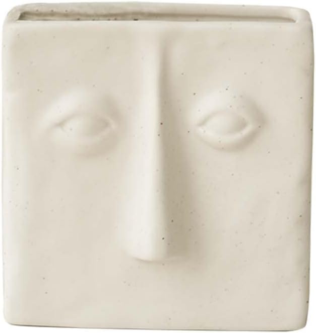 WENSHUO Ceramic Pen Holder, Pencil Holder for Desk, Desk Accessories, Crème | 3.7 in tall ceramic holder for pens, pencils, makeup brushes, or toothbrushes. Abstract face design displays small plants.