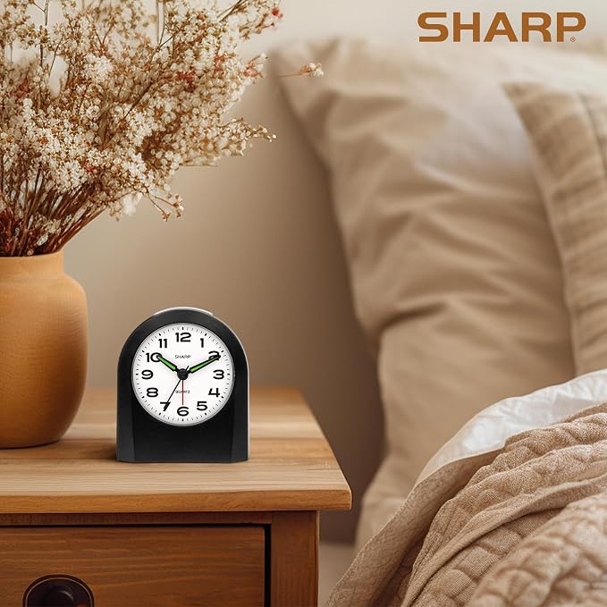 Sharp Battery-Powered Analog Alarm Clock, Silent Sweep, Snooze and Light | Silent no-tick movement; Ascending beep alarm; Gentle wake; Snooze; On-demand light; Compact size; Battery operated; Black
